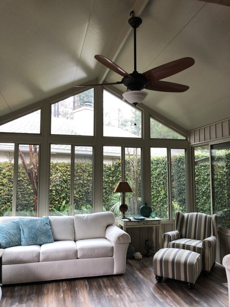 Four-season sunroom interior with insulated glass panels in Effingham County Georgia.