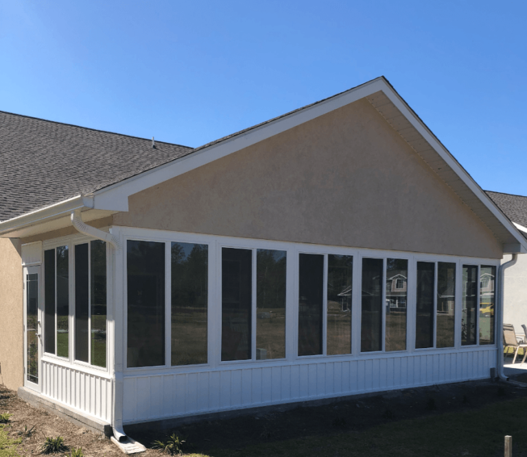 Screened sunroom addition on Glynn County home with Low-E glass panels.