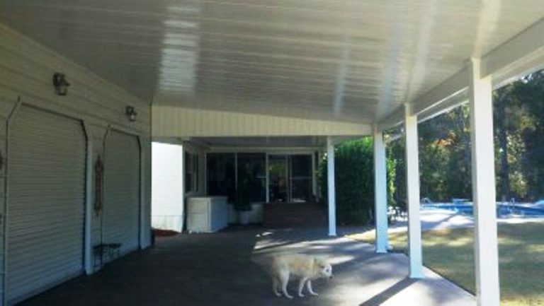 Insulated patio cover installed on Baxley Georgia home shading backyard from 89-degree summer heat