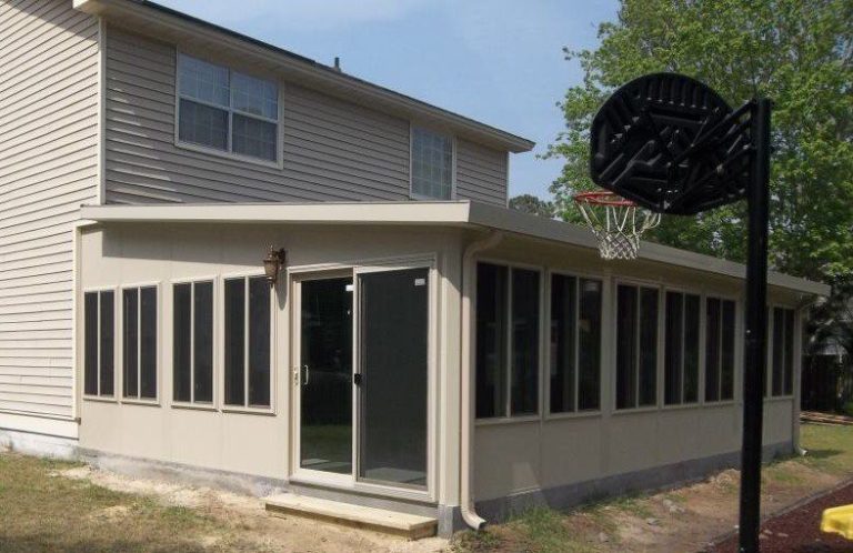 Bright sunroom interior in Brunswick Georgia with insulated panels on a warm coastal afternoon.