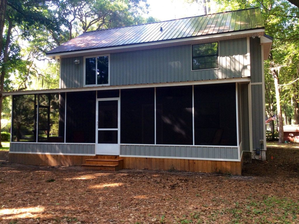 Screen room enclosure added to a 1980s brick home in Baxley Georgia.