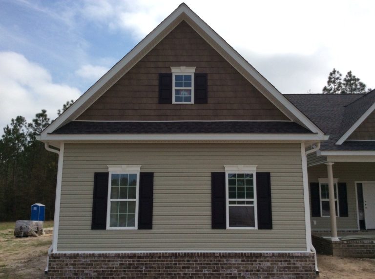 Vinyl soffit and fascia installation on a Rincon Georgia home protecting rafters from moisture.