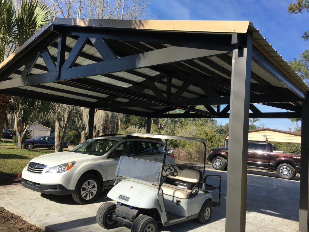 Aluminum carport installed near Fort Stewart shading a vehicle on a hot Hinesville summer afternoon.