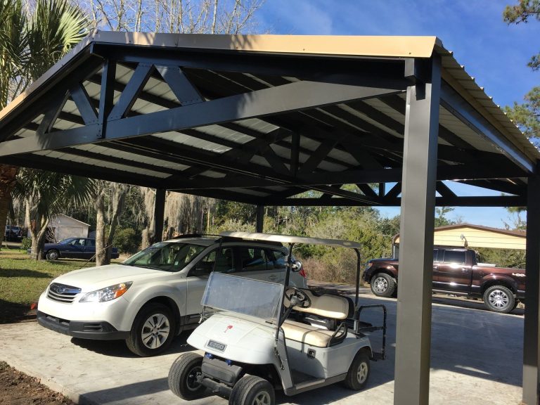Aluminum carport installation on a Statesboro Georgia home driveway on a hot summer afternoon