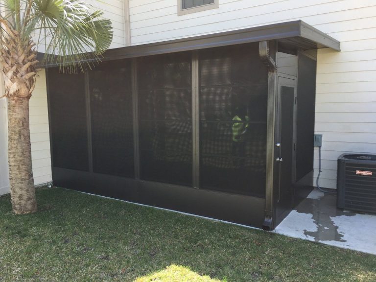 Vinyl glazed sliding panels on a Glynn County porch blocking mosquitoes and coastal humidity.