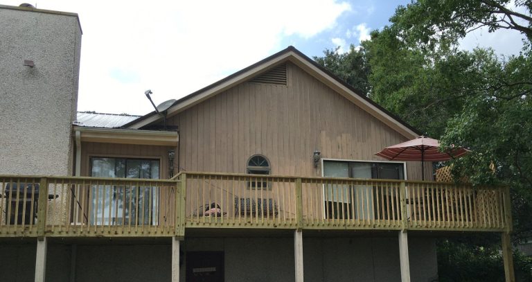 Pressure-treated deck with decorative columns installed in Bulloch County Georgia.