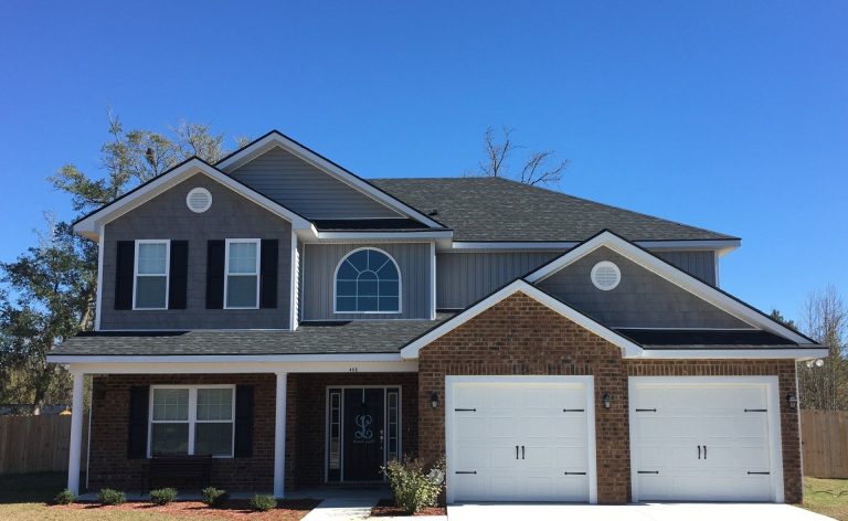 Matching vinyl soffit and fascia installed alongside new siding on a Jesup, GA home.