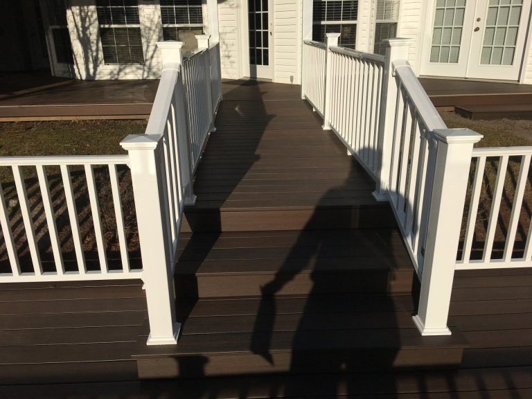 Custom wooden porch on Brunswick Georgia home near Glynn County coast with high tree canopy