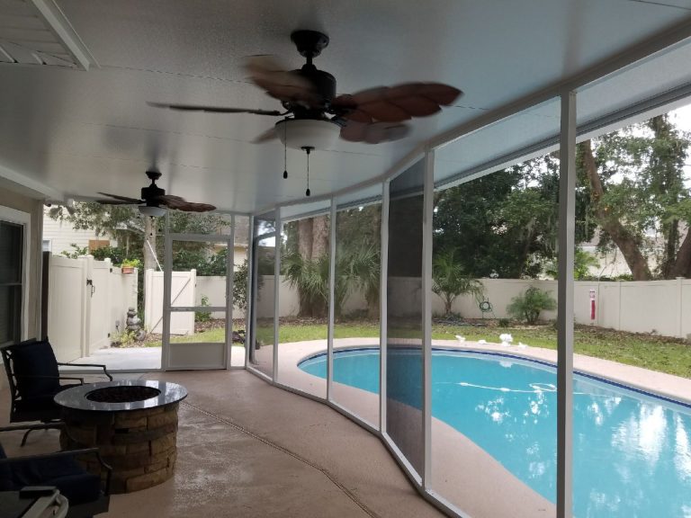 Finished screen room addition on a southeast Georgia home with open views to tree canopy.