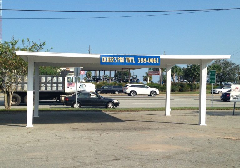 Covered patio with ceiling fan and screens on a southeast Georgia home near Darien.