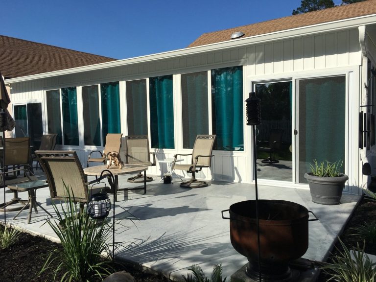 Four-season sunroom on a Claxton Georgia home built for 90-degree summers and moderate hurricane exposure.
