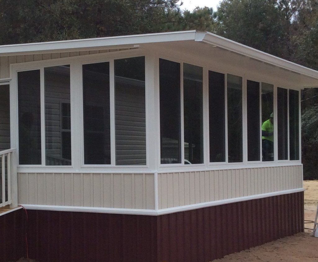 Sunrooms in Waycross, GA by Eicher's Pro Vinyl 2 Vinyl-framed sunroom addition on a Waycross Georgia home during a heavy southeast Georgia rain shower.