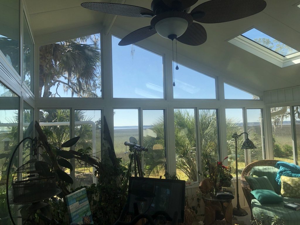 Vinyl-framed sunroom addition on a 1980s Baxley Georgia home in Appling County.