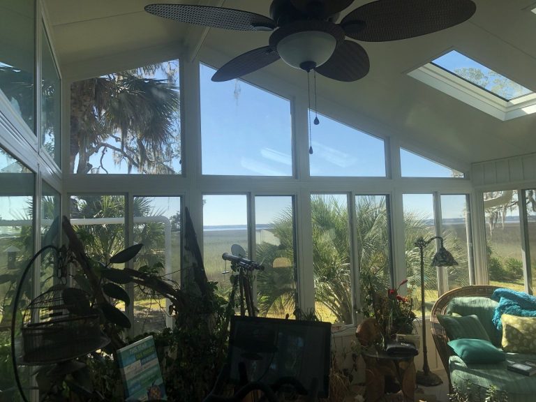 Vinyl-framed sunroom addition on a 1980s Baxley Georgia home in Appling County.