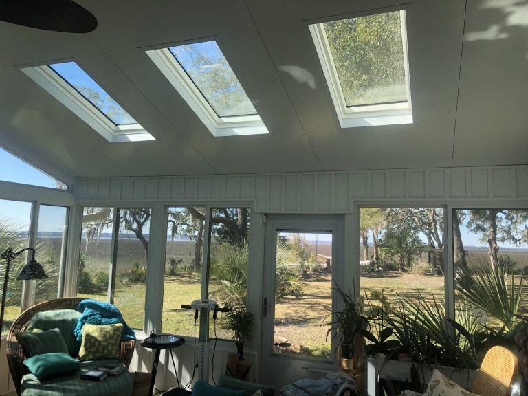 Four-season sunroom addition on a Rincon Georgia home with insulated vinyl framing.