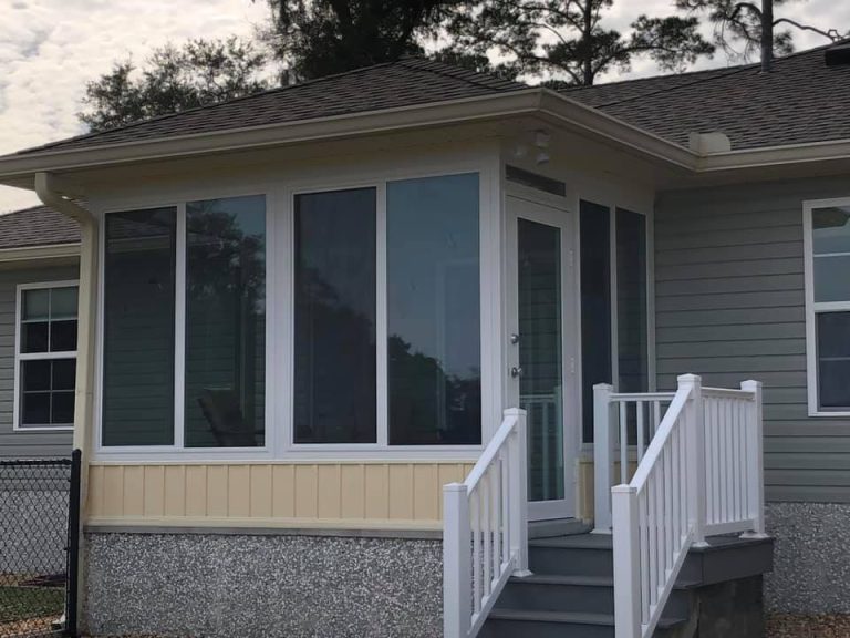 Four-season sunroom with low-E glass on a Wayne County Georgia home near Odum built for coastal wind exposure.