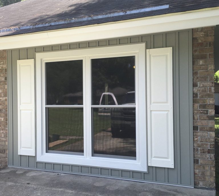 Close-up of 20/20 gnat-resistant screen and extruded aluminum frame on a Baxley Georgia replacement window.