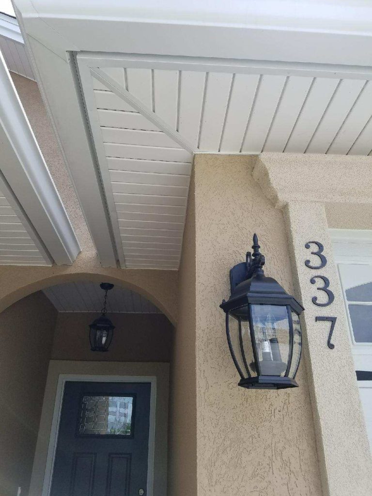 Lap vinyl siding panels on a McIntosh County home after heavy rain season