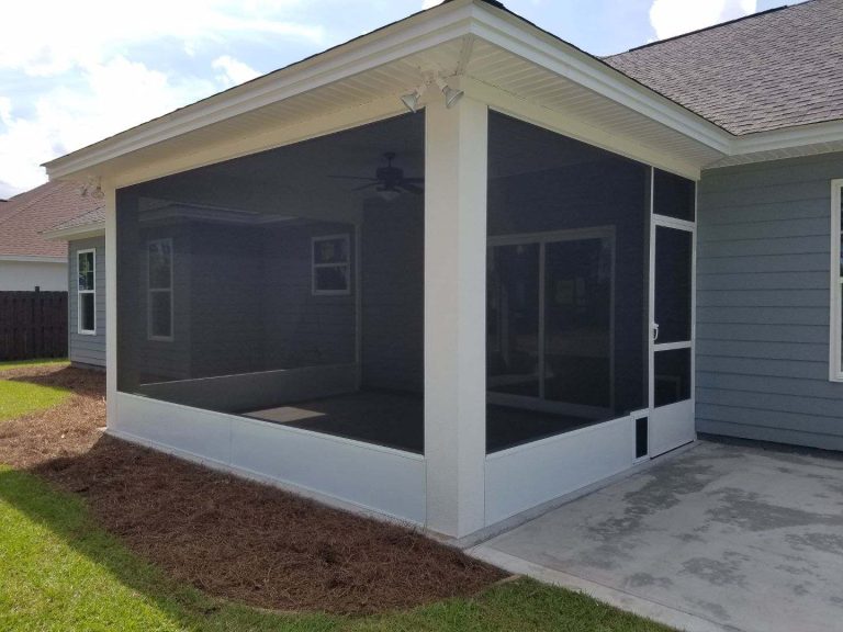 Attached screen room enclosure on Jeff Davis County home surrounded by Georgia tree canopy.