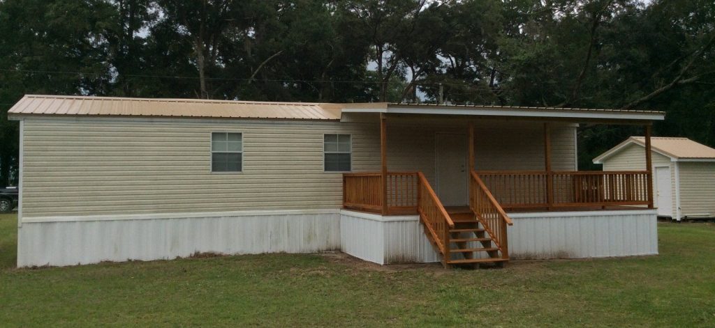 Covered wooden porch built for Hazlehurst Georgia heat and 157 annual mosquito days