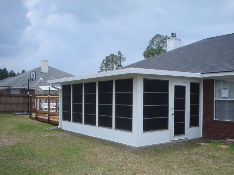 Custom vinyl glazed sliding panels installed on a Lyons Georgia backyard deck enclosure.