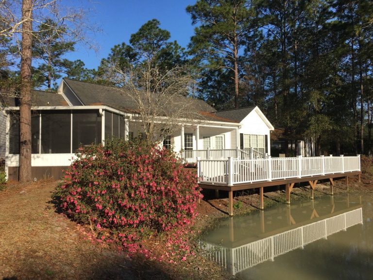 Custom wood porch with decorative railing built for Jeff Davis County humidity