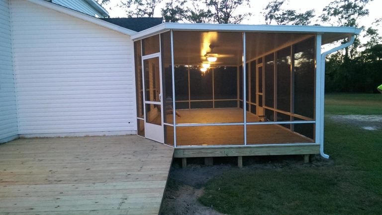 Pressure-treated pine porch with decorative columns on a Nahunta Georgia home