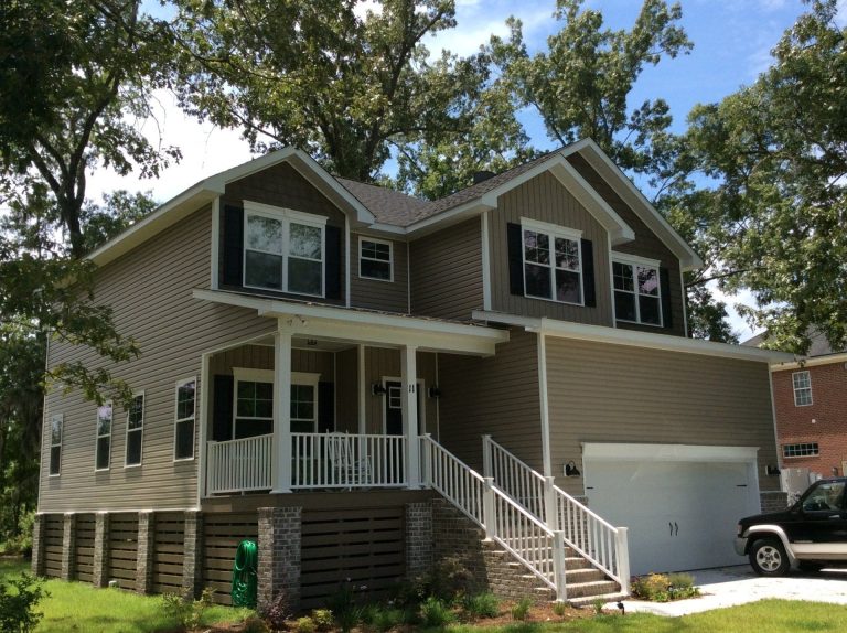 New vinyl siding installed on a Savannah Georgia home after heavy rain season damage.