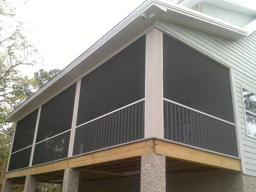 Screened porch enclosure on a Glennville Georgia home with views of the coastal plain landscape.