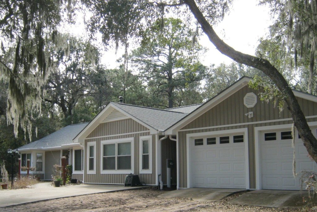 Vinyl siding installed on a late-1980s Glennville Georgia home in Tattnall County's summer heat.