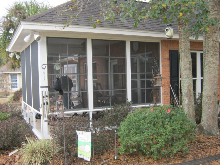 Custom 10-mil vinyl glazed sliding panels installed on a McIntosh County back deck