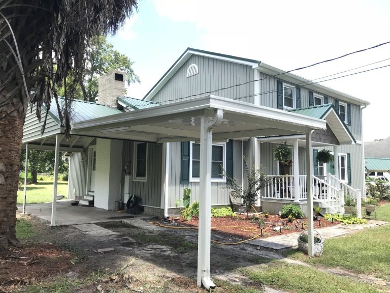 Custom patio cover with ceiling fan installed on Bryan County Georgia backyard slab.