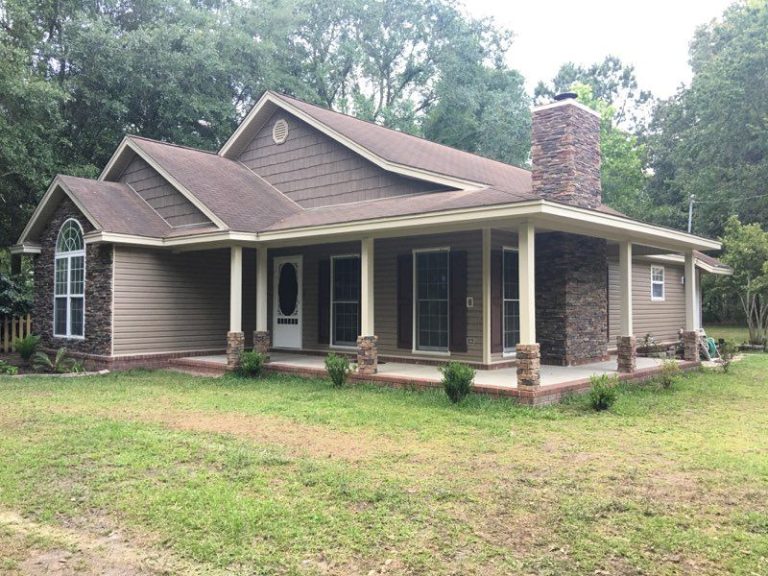 Vinyl siding installation on a Long County home in Ludowici Georgia's humid high-termite-risk climate.