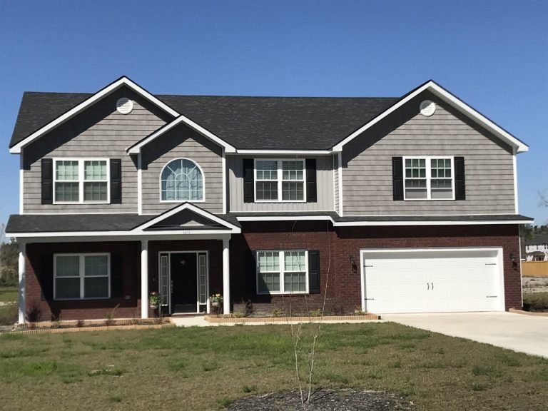 New vinyl siding installed on an Effingham County home during a wet Guyton Georgia summer season.
