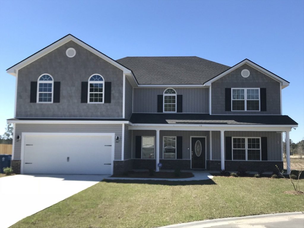 Color Through vinyl siding panels on a Claxton Georgia home with Evans County tree canopy and coastal wind exposure.