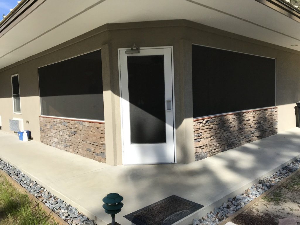 Aluminum screen room addition on a Liberty County Georgia home near Midway with 20/20 gnat-resistant mesh installed by Eicher's Pro Vinyl employees.