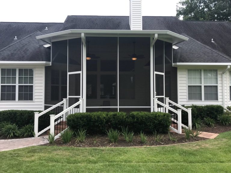 Aluminum-framed screen room addition on a Claxton Georgia home with roofline flashing detail.