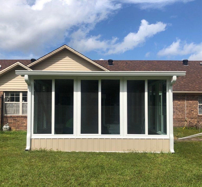 Custom vinyl-framed sunroom addition on a Lyons Georgia home in Toombs County on a warm summer morning.