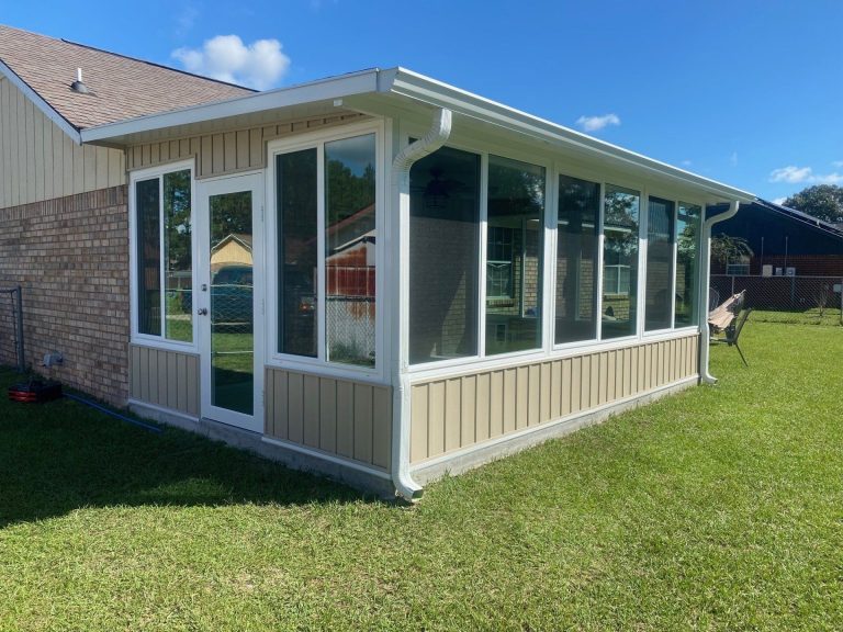 Aluminum-framed sunroom addition on a Brantley County Georgia home built for high-wind exposure.