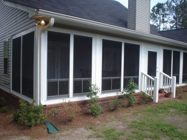 Custom vinyl glazed sliding panels installed on a Coffee County Georgia porch near Douglas.