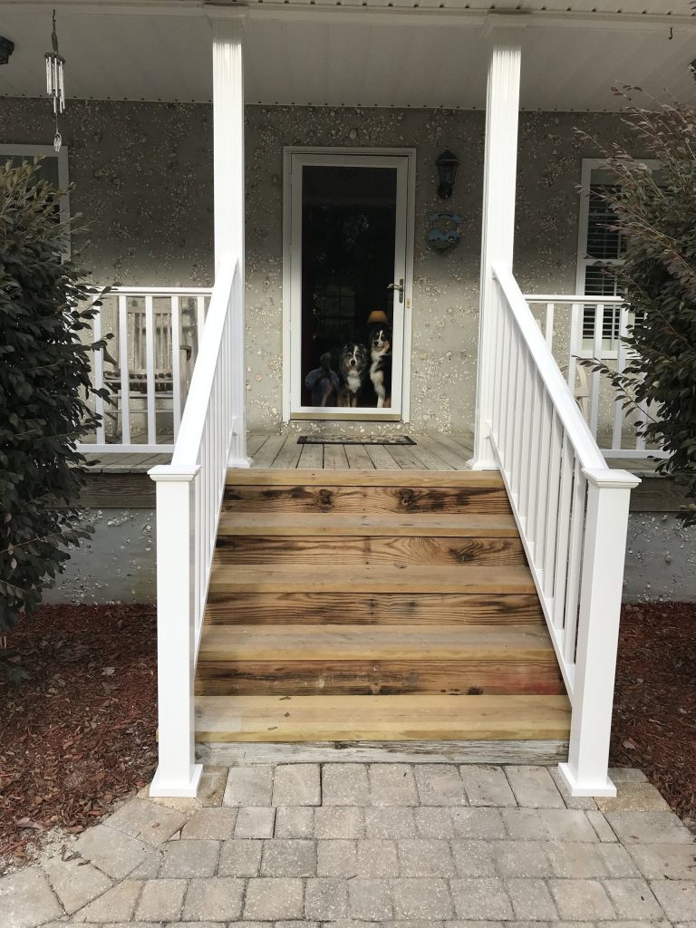 Pressure-treated deck stairs and railings installed in Springfield Georgia backyard