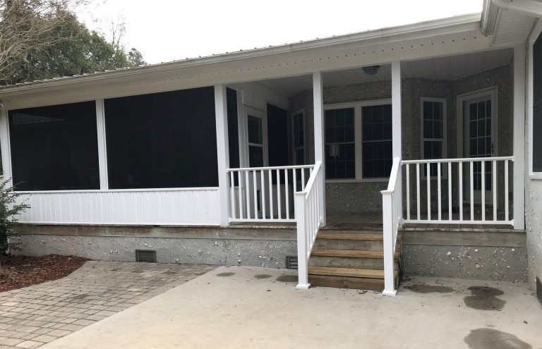 Finished screen room enclosure in Claxton Georgia with tight mesh panels and open patio view.