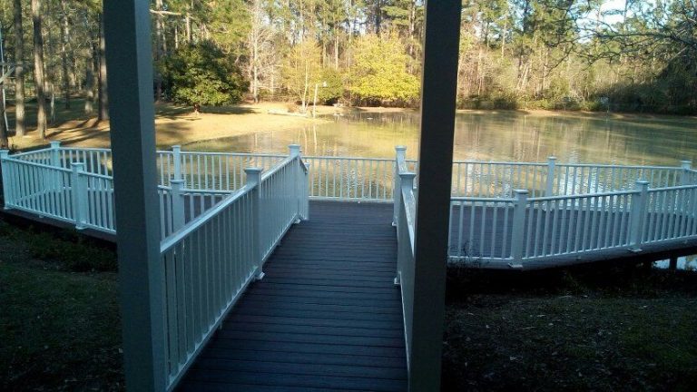 Covered wooden porch on a coastal Georgia home built to handle high hurricane exposure winds.