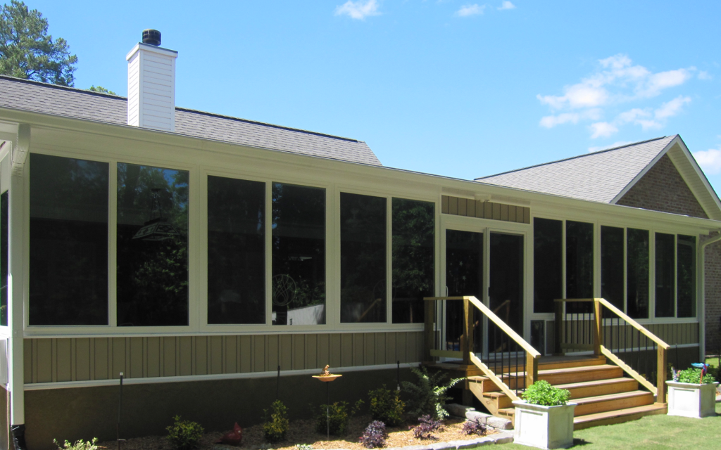 Insulated sunroom glazing and vinyl framing on a McIntosh County Georgia home in hardiness zone 9a.
