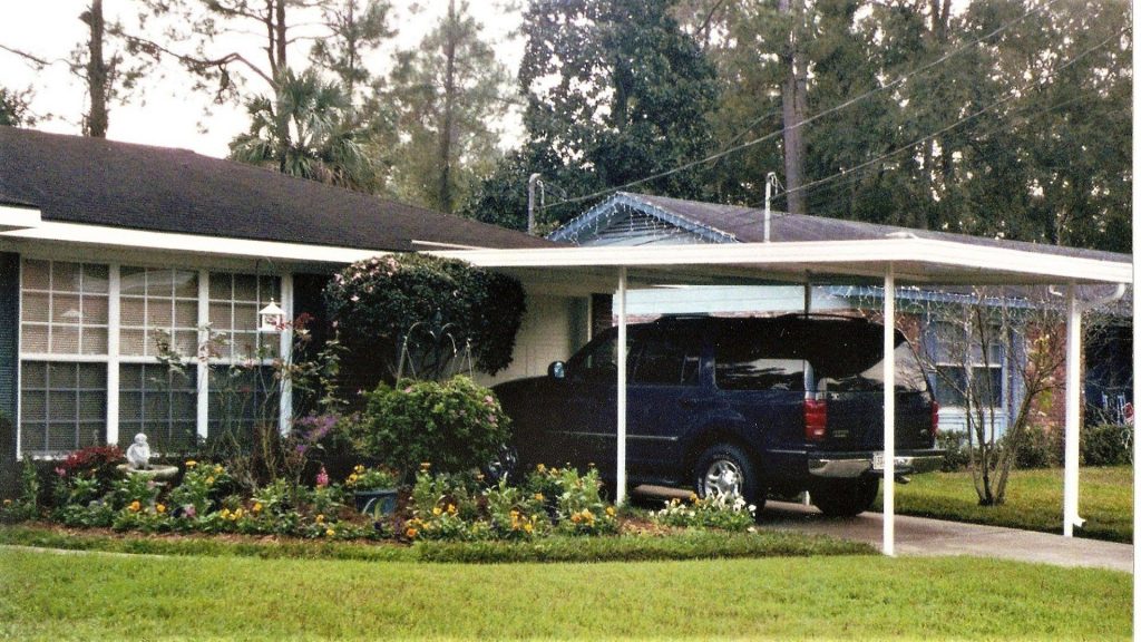 Aluminum patio cover on a Douglas Georgia home shading against 89-degree summer heat.