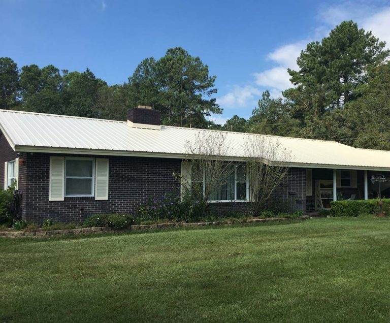 Galvalume metal roof installed on a historic Savannah Georgia home near Forsyth Park under summer sun