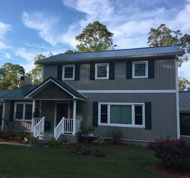 Standing seam metal roofing on a Pierce County home surrounded by Georgia tree canopy.