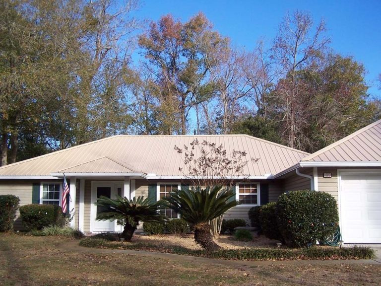 Eicher's Pro Vinyl crew installing standing seam metal roof on a Midway Georgia home in Liberty County.