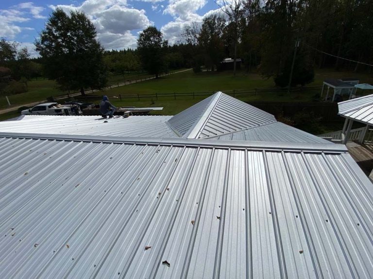 Metal roofing panels on a Patterson Georgia home showing color and standing seam detail
