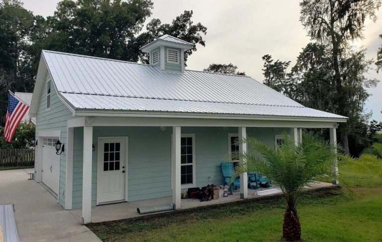 Galvalume metal roofing installed on a 1970s-era home in Waycross, Georgia under bright summer sun